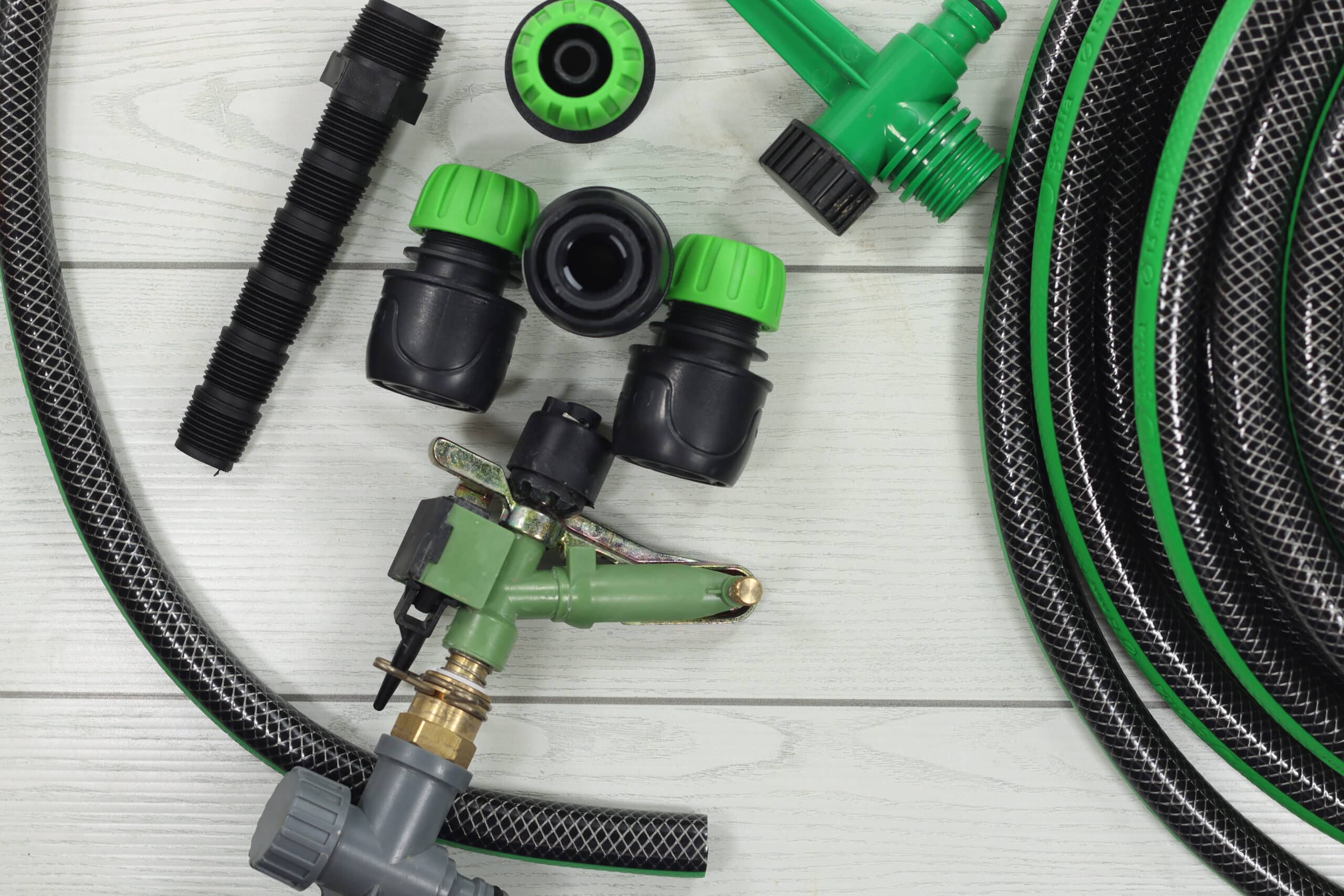 Drip irrigation starter kit accessories laid out for comparison