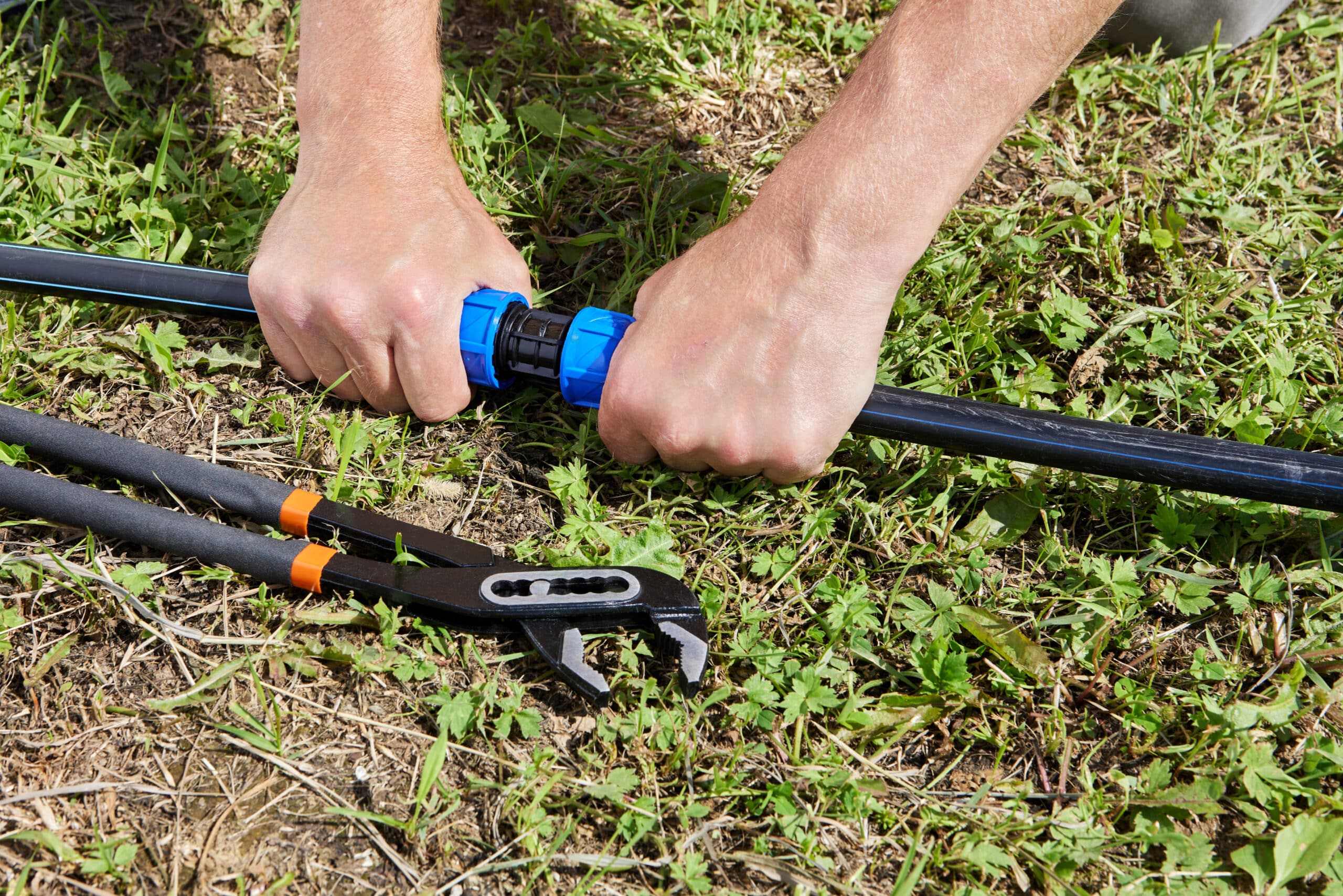 Polyethylene tubing connected with a barbed coupling fitting for drip irrigation