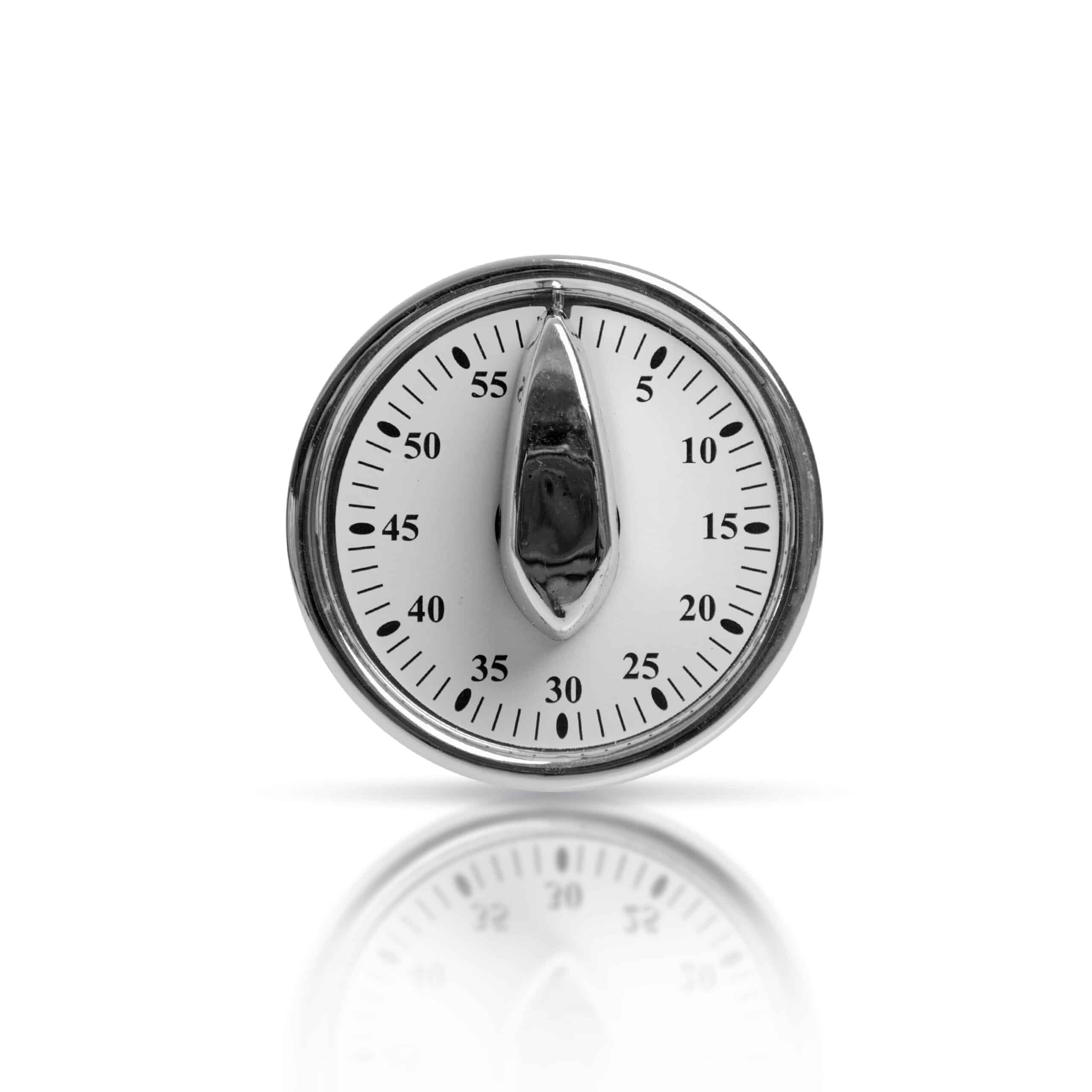 Close-up of a hose timer dial showing a watering program setting